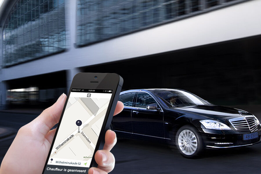 black taxi cab and a smart phone in hand tracking taxi online