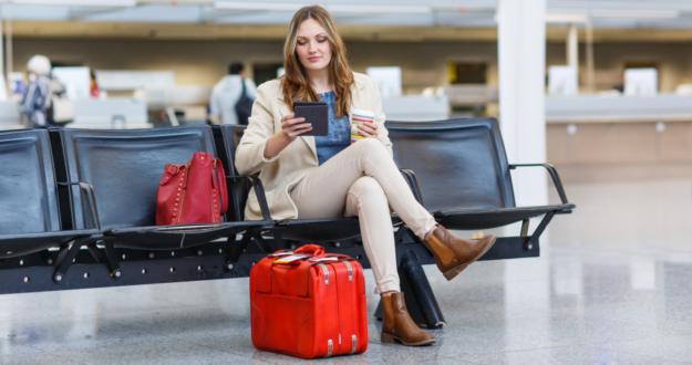 Airport transfers – Bracknell Lady siting on a bench at the airport